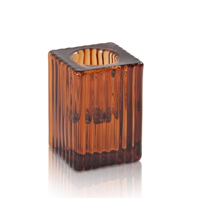 Brown glass candle holder on a white background