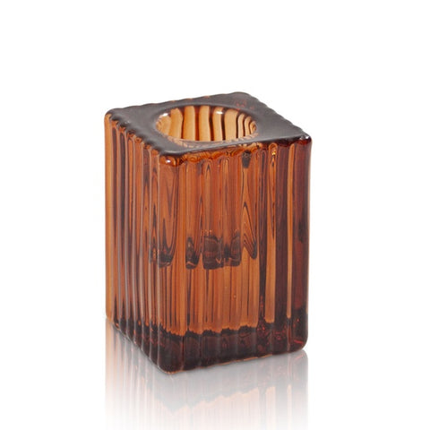 Brown glass candle holder on a white background