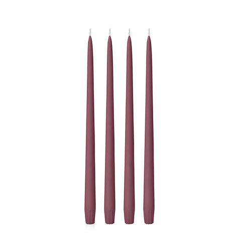 Four burgundy 25cm candles on a white background