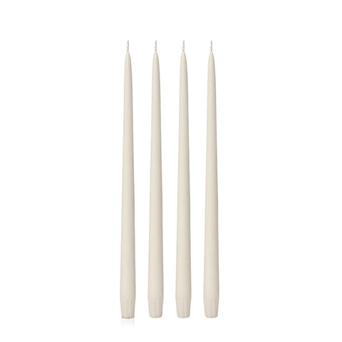 Four ivory 25cm candles on a white background