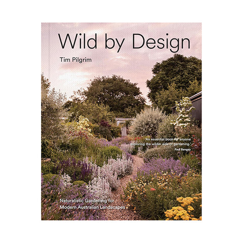 Book cover of 'Wild by Design' with a garden scene and author's name.
