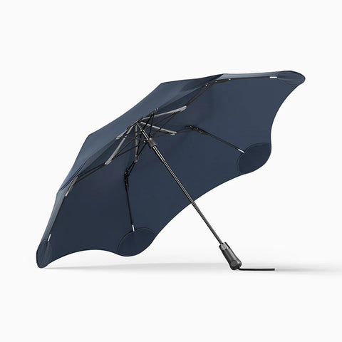 Dark blue umbrella on a white background