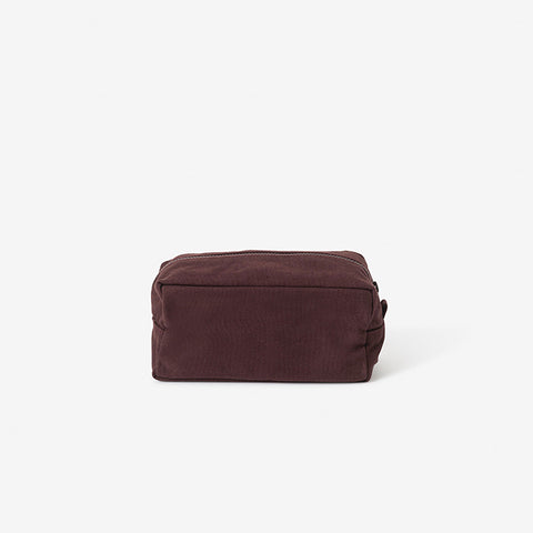 Large Marlo Wash Bag in Mulberry by Citta sits next to a white cup & toothbrush