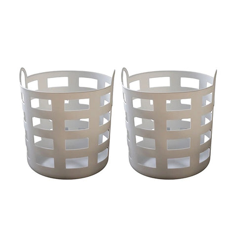 White laundry basket on a tiled floor with a washing machine in the background