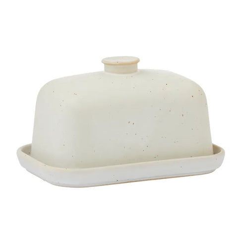 White ceramic butter dish with a lid on a white background
