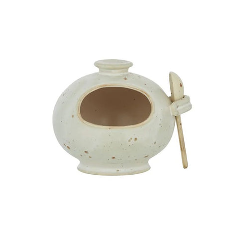 Speckled ceramic salt pig with a ceramic spoon on a white background by Coast to Coast