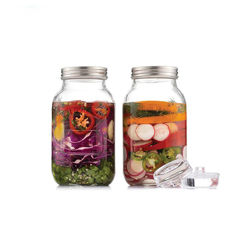 Two clear Kilner jars with metal lids on a white background