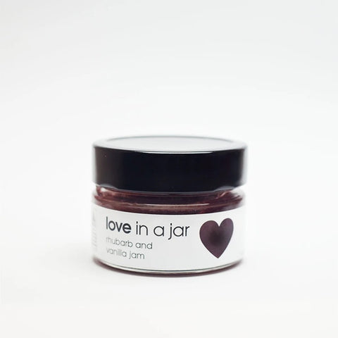 Jar of 'love in a jar' jam with a white background