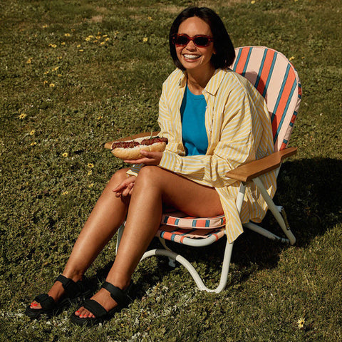 Black sandals with velcro straps on a white background