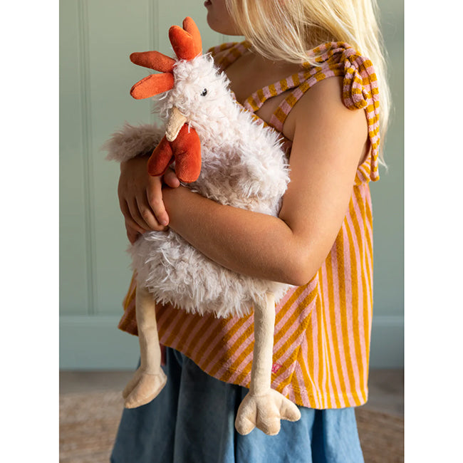 girl holding Roy The Rooster Soft Toy by Nana Huchy
