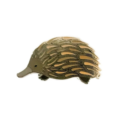 Metallic bird-shaped object on a white background