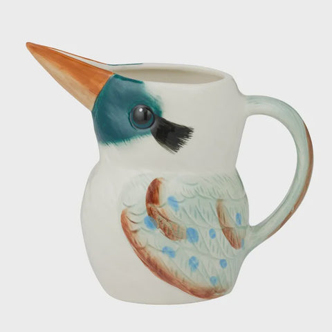 Ceramic jug shaped like a bird on a white background