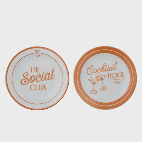 Two coasters with 'The Social Club' and 'Cocktail Hour' text on a light gray background