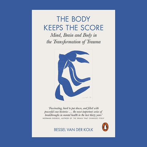 Book cover of 'The Body Keeps the Score' with a blue silhouette of a person on a white background.