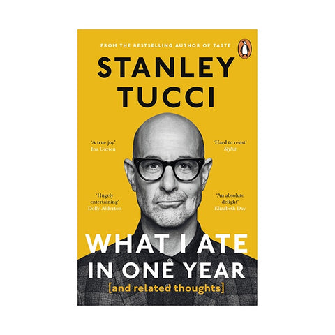 Book cover of 'What I Ate in One Year' by Stanley Tucci with a yellow background and black text.