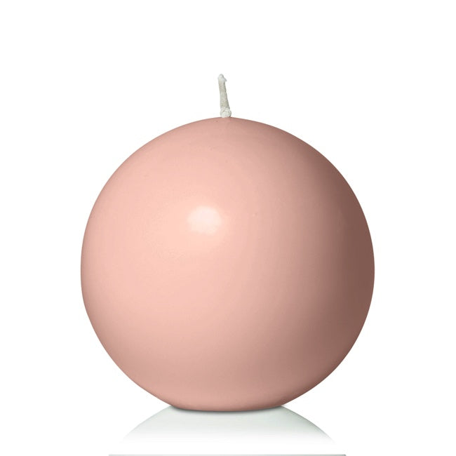 pink sphere candle on white background